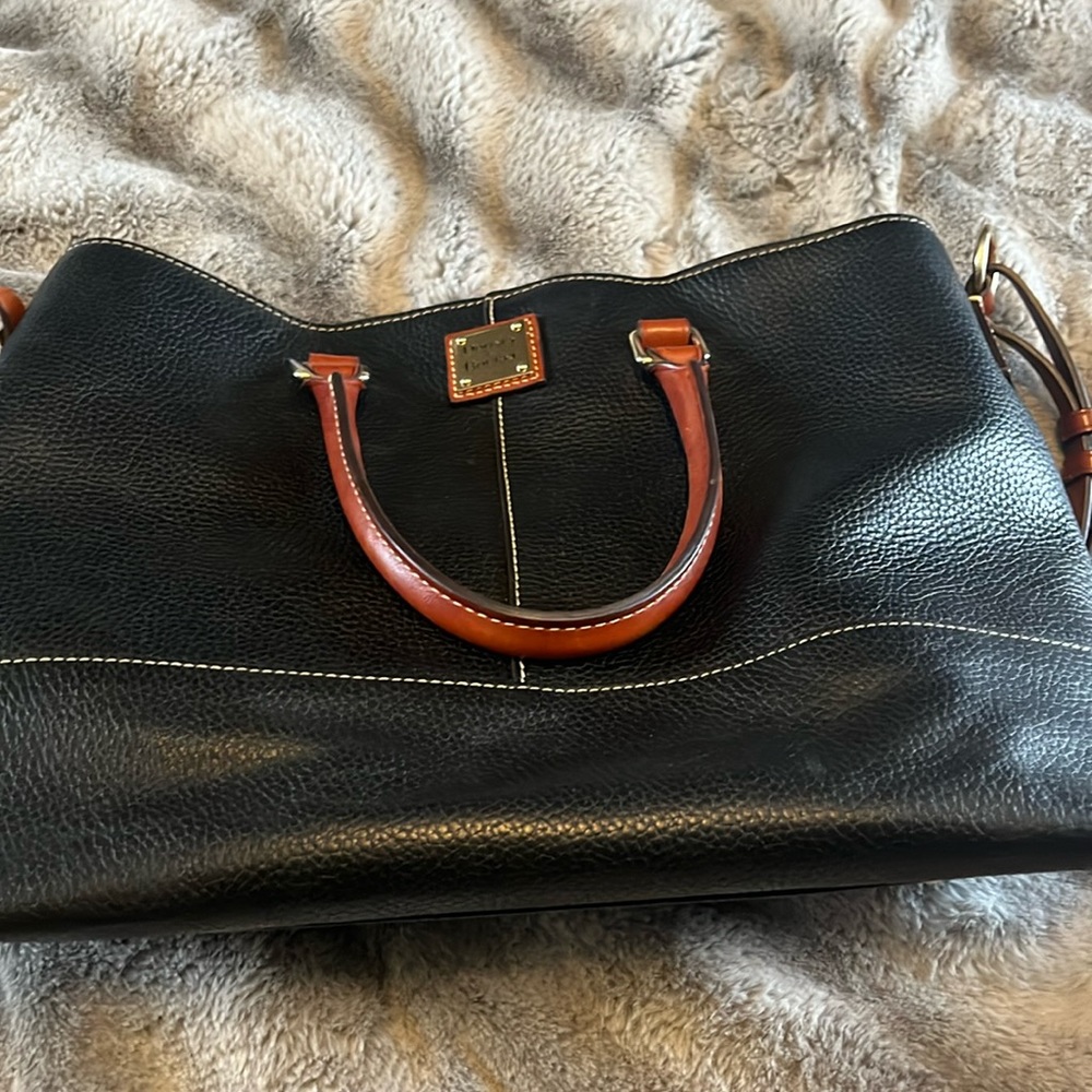 Dooney & Bourke lightly used purse. Black and brown in color. Medium sized